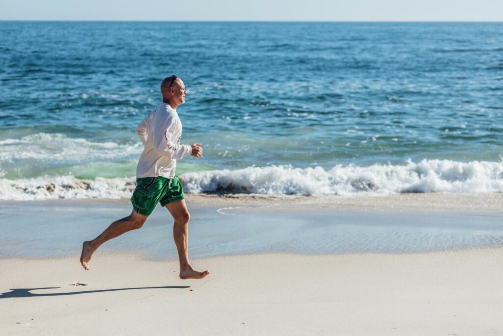 Body when mindful - Man running on beach
